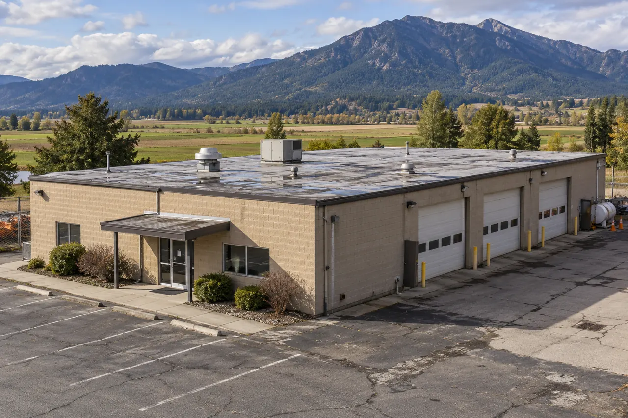 One-story block commercial building with a flat roof and roll-up doors
